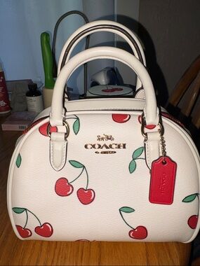 Coach White Leather and Signature Canvas Sydney Satchel with Red Cherry Print
